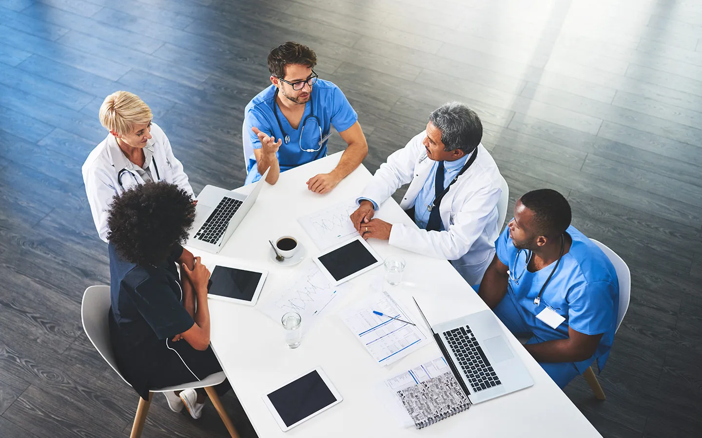 team of docs at a table